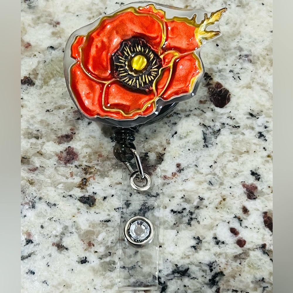 Flower badge reel. Badge pull.